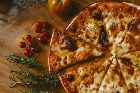 Freshly baked pizza on a wooden board